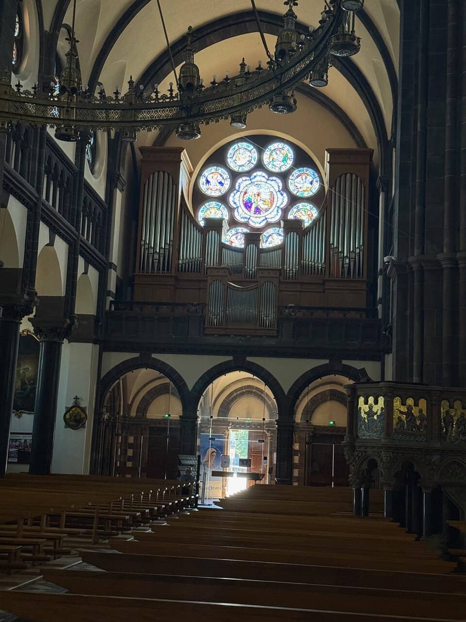 Vibrant Frescoes and Choir Screen