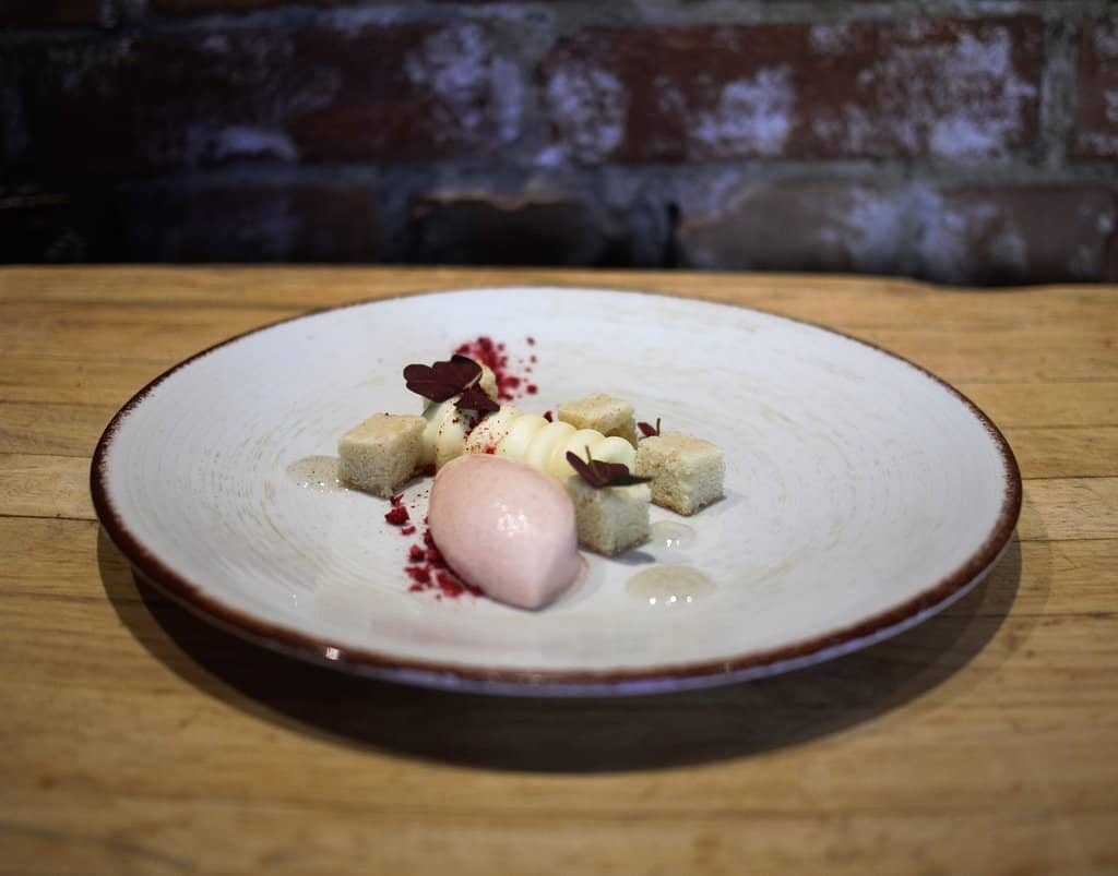 White chocolate mousse with brown butter cake and bellini sorbet