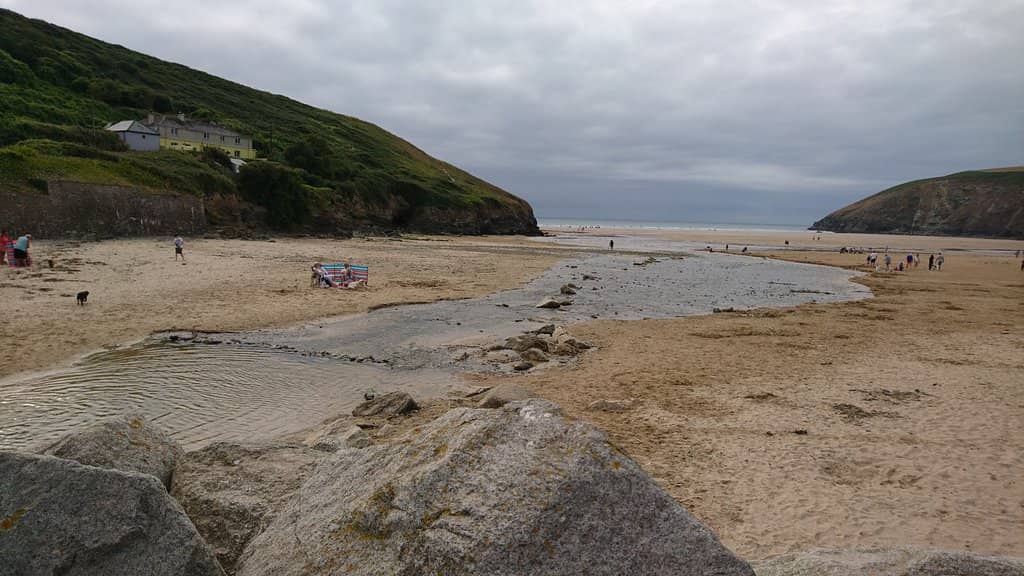 Golden Sands and Dramatic Cliffs