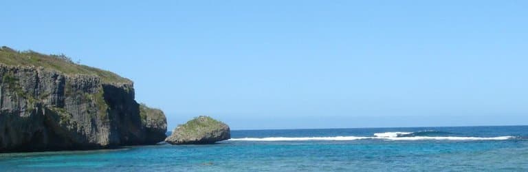 Swimming area w/ the shadows being sea grass.