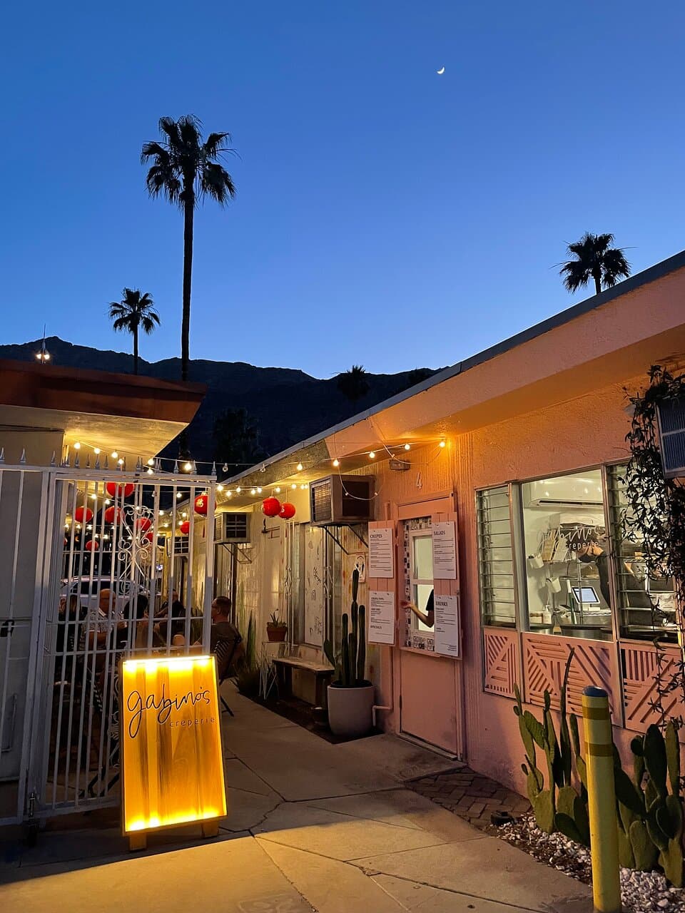 Walk up window with cute alley seating