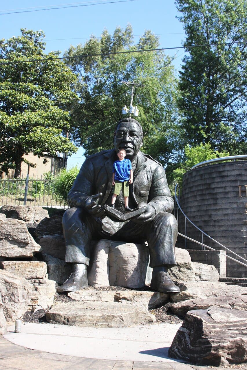 I realized that there is a pole "sticking out of his head" when I took this shot, but I was more interested in capturing the moment with the kid, who clearly was posing for a picture.