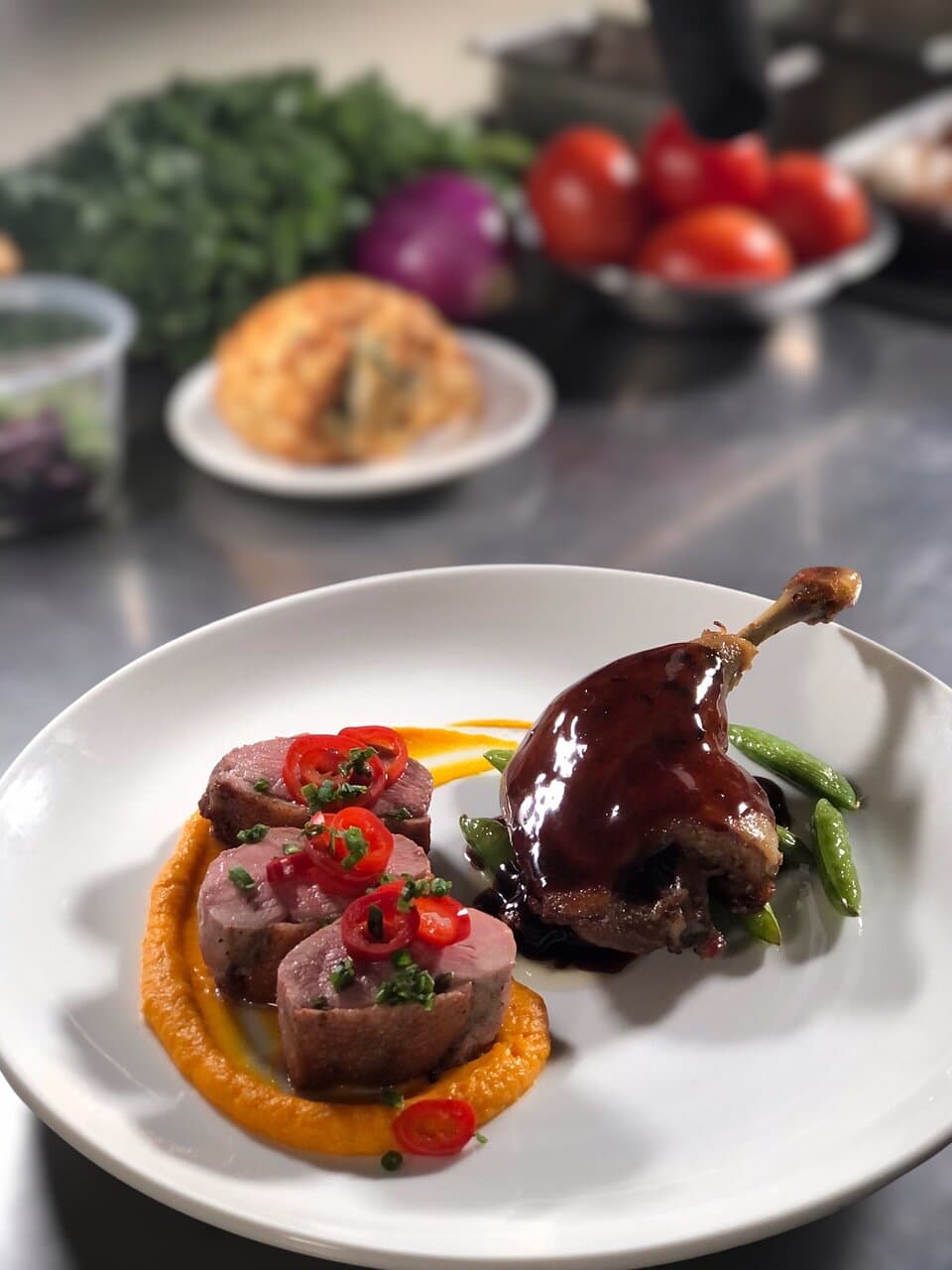 duck duck demi | 
roasted duck breast + confit leg, carrot-ginger purée,
pickled fresno peppers, sautéed snap peas,
grand marnier + orange duck demi-glace