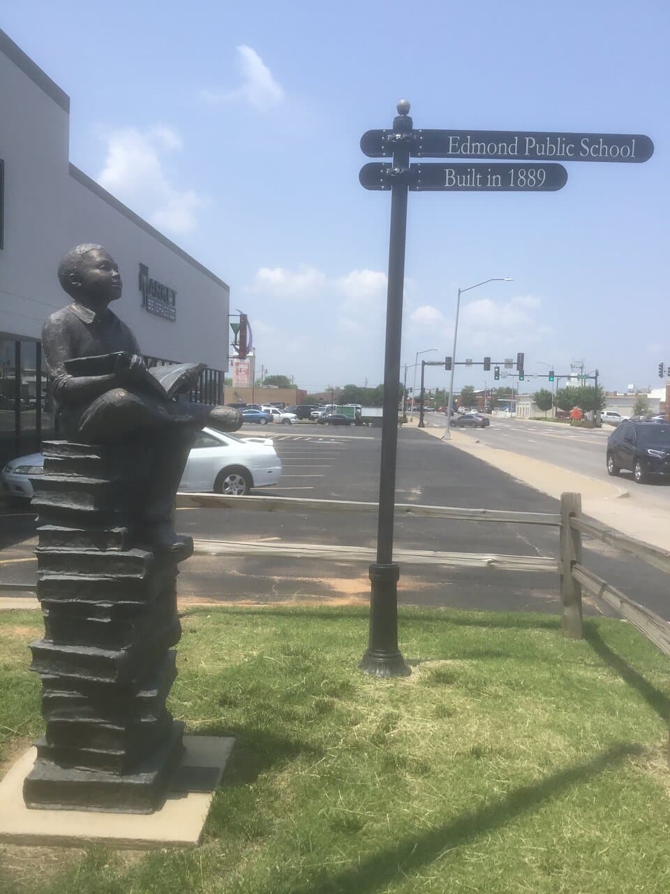 Sculpture of boy on stack of books