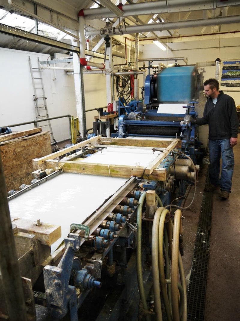 Papermaker Gary besides the 'Pilot' papermaking machine
