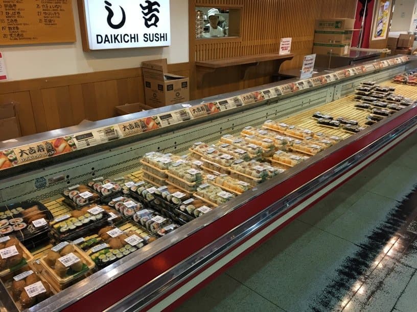 The sushi counter. You grab what you want, and pay at the casher, who wil give you the soy sauce
