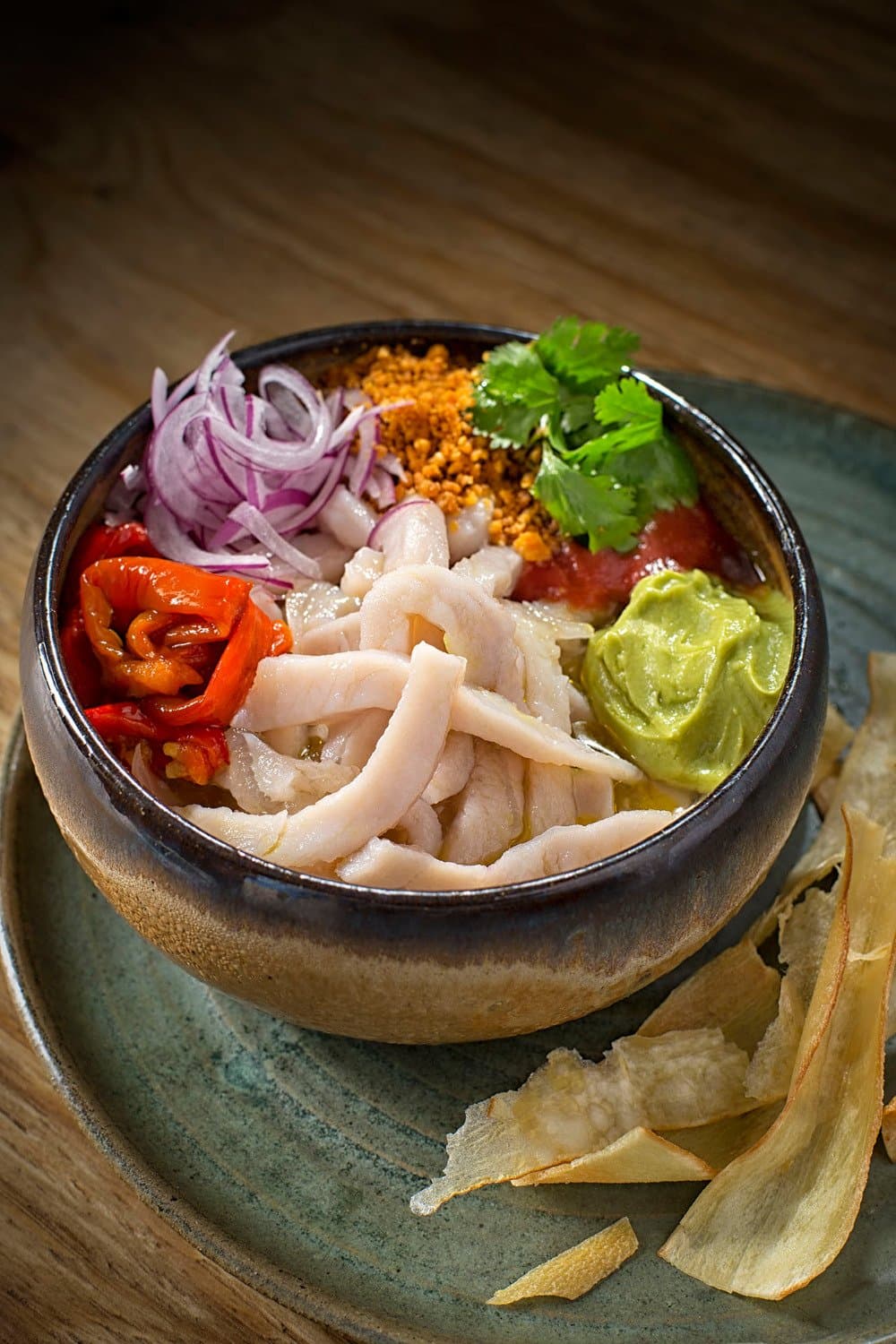 Our own interpretation of ceviche with avocado and roasted peppers