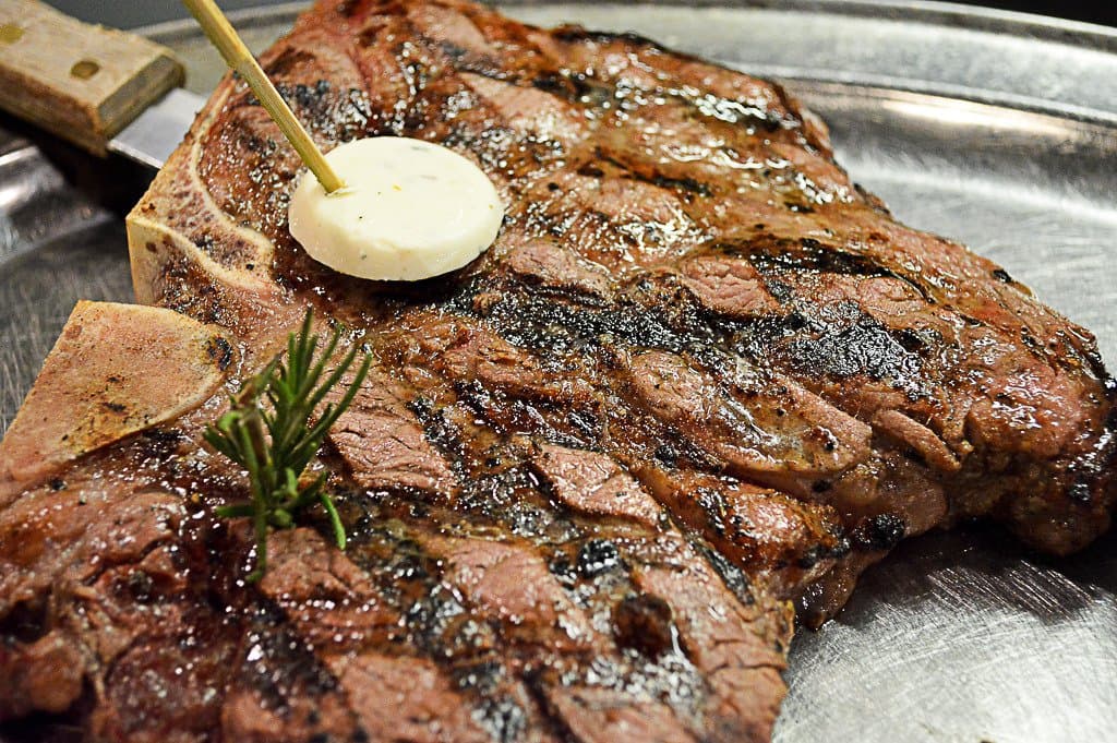 The Porterhouse! The 26 ounce King of steaks. This jumbo T-bone with a large tenderloin and stri