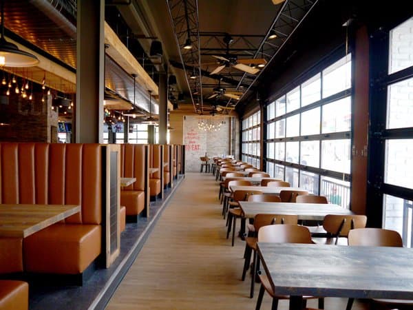 Street-side dining on Clifton Hill. These garage doors open too.