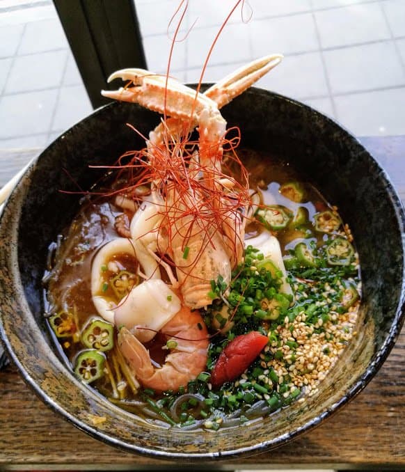 prawns and squid in pork broth with mungbean noodles, sesame, okra.