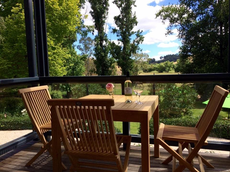Enjoy the view from our deck with a glass of one of our premium wines
