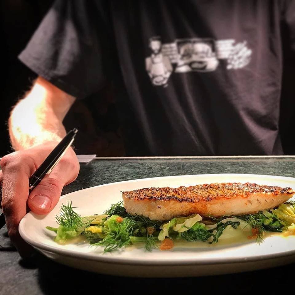 grilled black bass, butter braised cabbage