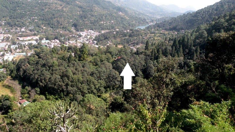 The white arrow points to the BRC, with the Bhimtal valley behind and Bhimtal lake towards the upper right hand side of the photo.