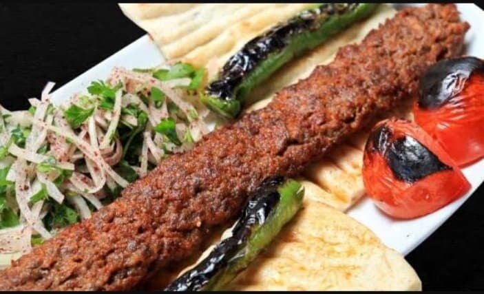 Adana kebap and salad