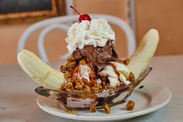 Outrageous Banana Split Vanilla, Chocolate, Strawberry Ice Cream, Two Bananas, Peanuts, Walnut Topping, Hot Fudge, Caramel, Whipped Cream, Cherry & Chocolate Shavings