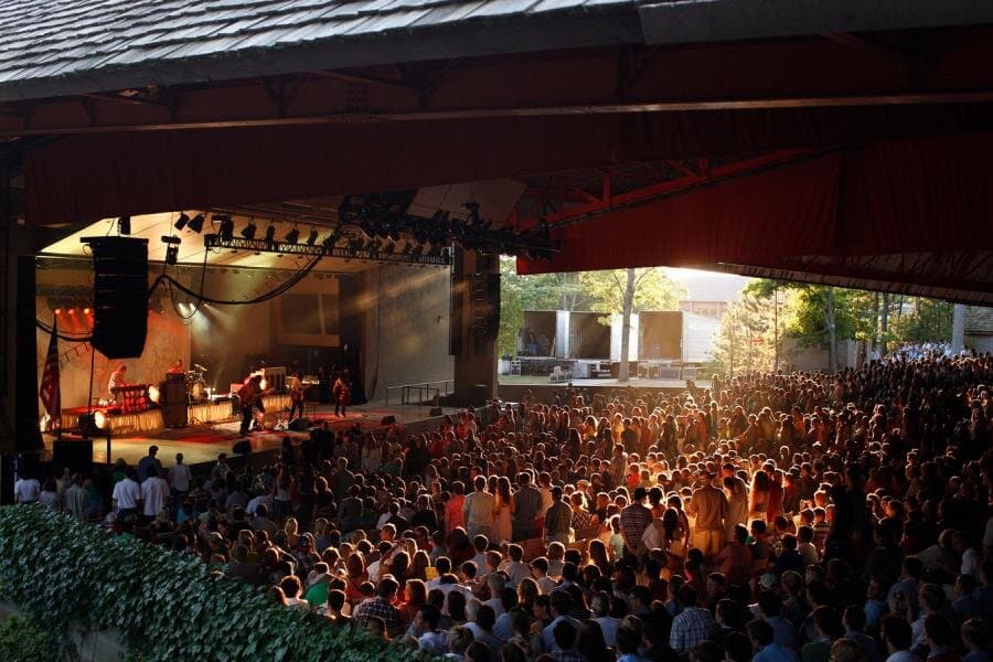 Dedicated to the promotion of world friendship through the universal language of the arts.
At 3,917 seats, Kresge Auditorium is Interlochen Center for the Arts' largest performance venue. Located on the shores of Green Lake, Kresge offers stunning views of the waterfront through spacious arched windows. The covered pavilion features open sides, allowing lake breezes to cool patrons as they enjoy concerts and events. Kresge Auditorium was first constructed in 1948 and expanded in 1964.