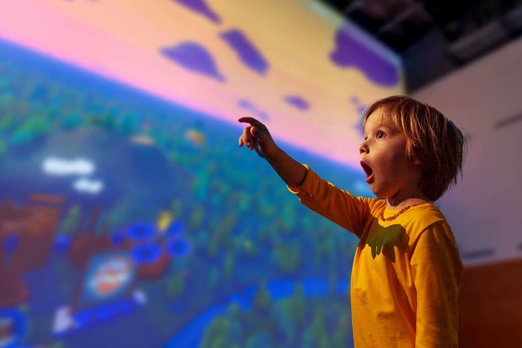 Curiosity Hall is a grand courtyard that soars over 50 feet above. Become a part of this multimedia experience as you craft your own flying machine, design a self-portrait, and make a fit kid!
