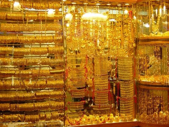 The gold boutiques display windows is lit up brilliantly to show off their gold-wear shades!