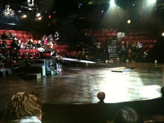View of stage from second row seat, aisle.
