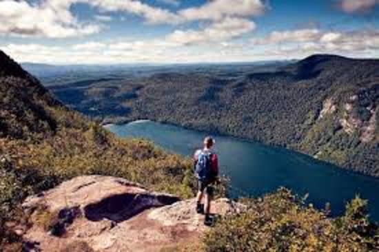 standing on a cliff by the river