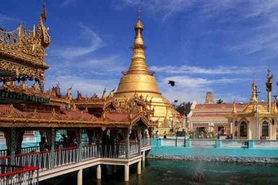 The Botataung Pagoda on the banks of the river in downtown Yangon is one of the city’s most highly revered temples. The 40 meter high golden pagoda enshrines a sacred hair relic of the Buddha.  The Botataung Pagoda, also spelled Botahtaung Pagoda was built some 2,500 years ago by the Mon people. In the second World War the pagoda was destroyed during an airforce bombing mission aimed at the nearby docks. Rebuilding started in 1948 following the original design.  In the center of the tiled platfo