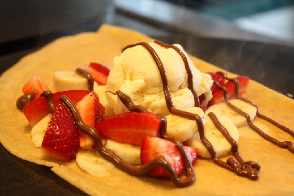 Nutella, fresh strawberries, banana, whipped cream, ice cream crepe