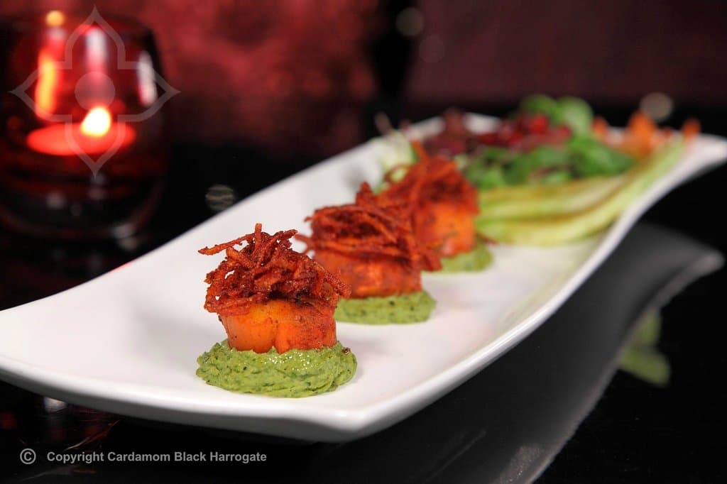 Scottish scallops on spiced pea puree