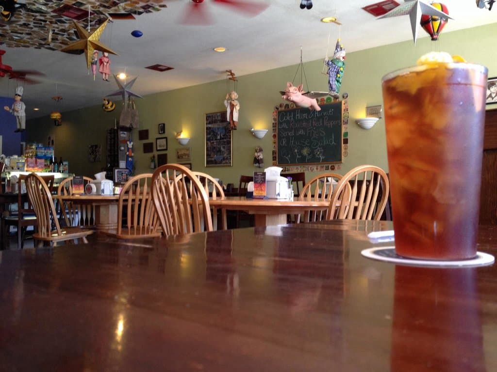 Tall glass of brisk iced tea with a wedge of lemon and/or orange. Ahhhh