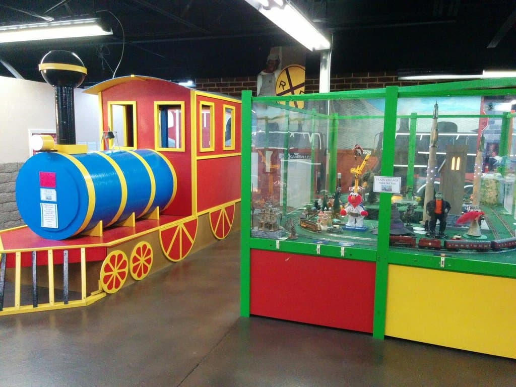 Big play train & electric train w/ buttons to push. Both make lots of sounds.