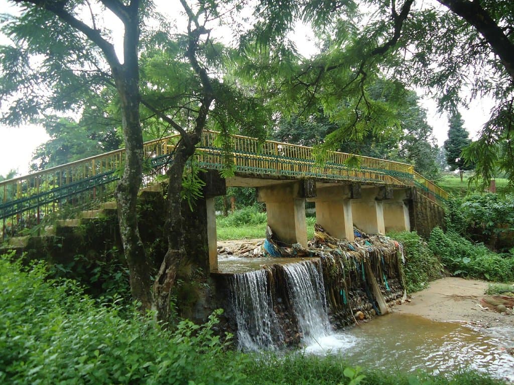The bridge over the stream and the small waterfall.