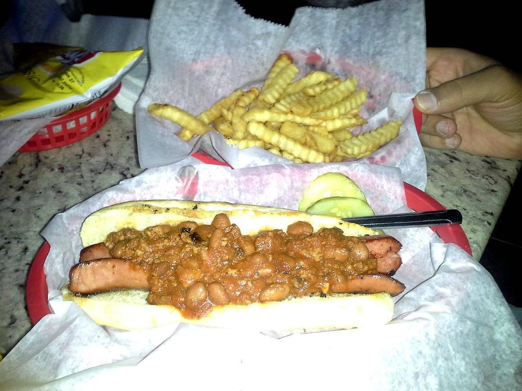 Awesome chili dog and small basket of fries.