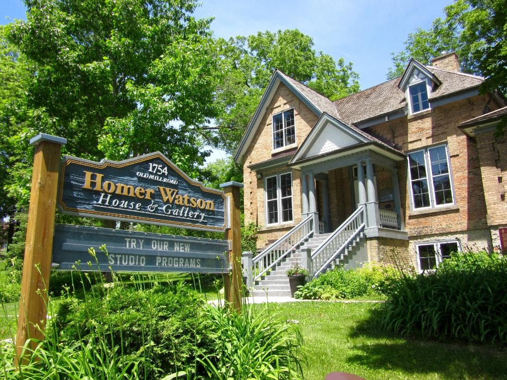 House & Welcome Sign