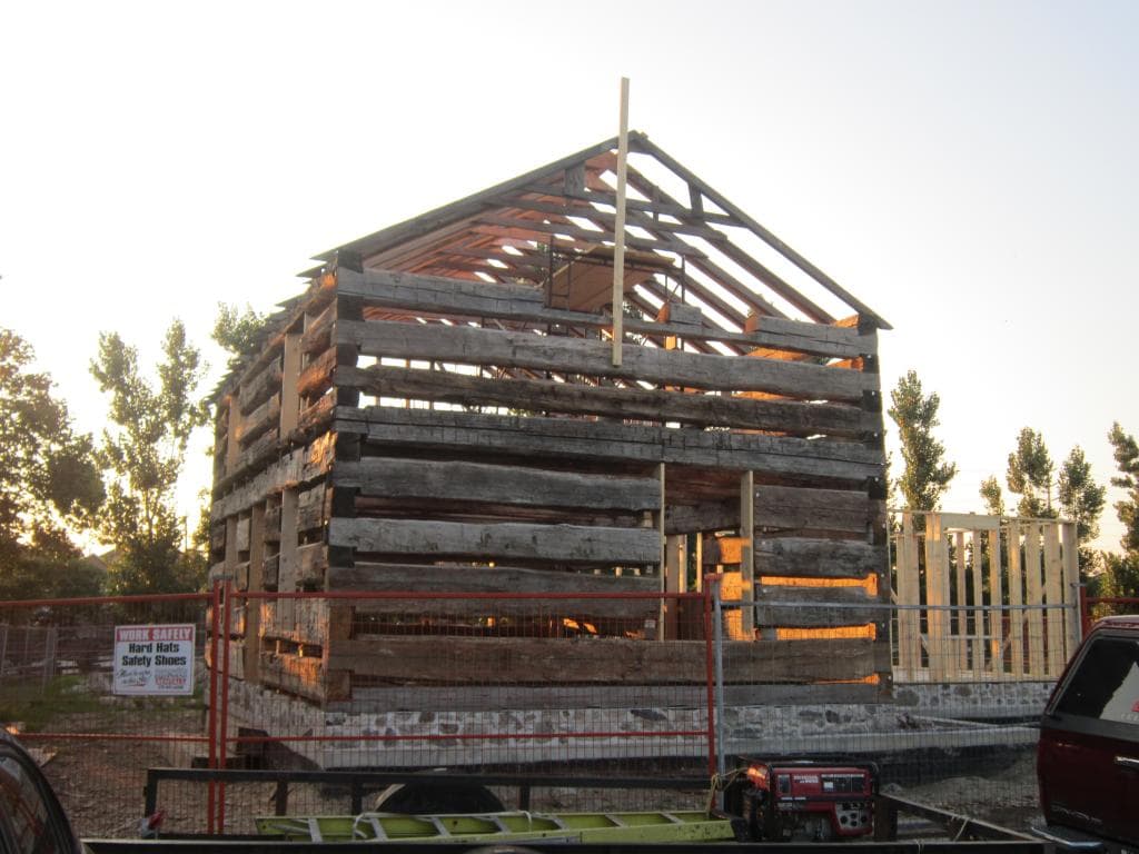 log house being assemble on the property