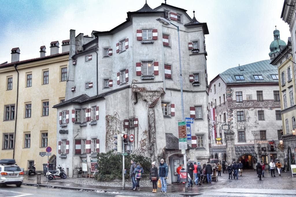 The Ottoburg faces the Inn river beside the main bridge.