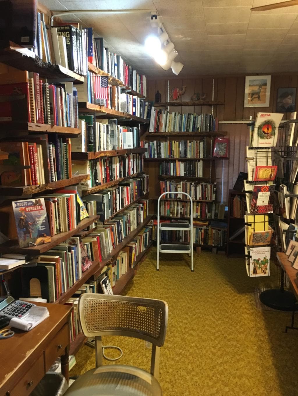 one of the rows of books to rummagge through, but if you remove a book do not return to the shel