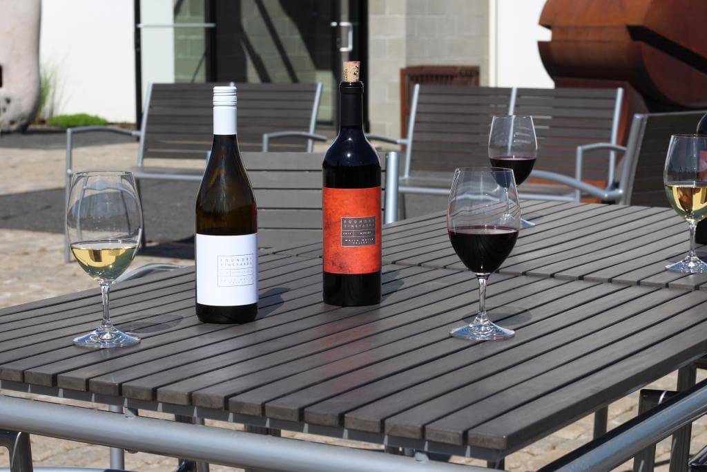 Enjoy a glass of wine in our sculpture garden.