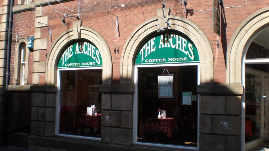 a view from Fisher Street. Note: "The Arches Coffee Shop", not Archers.
