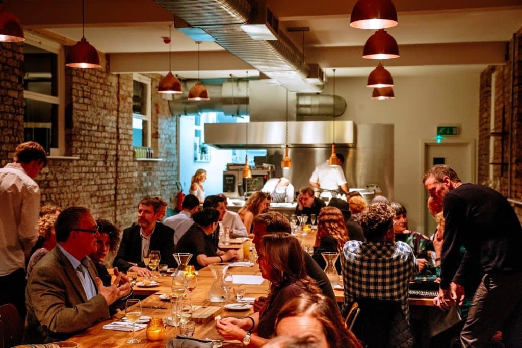 Guests enjoy dinner in The Dining Room at Buyers Club