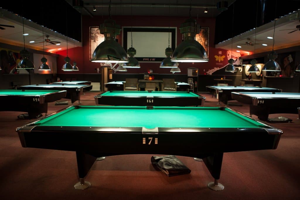 The poolhall with a view of the beamer screen