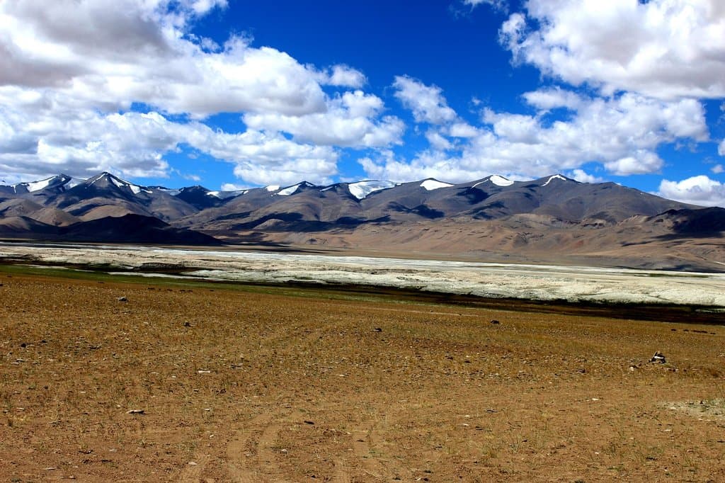 LAKE TSOKAR ALONG MOUNTAIN RANGE, LADAKH