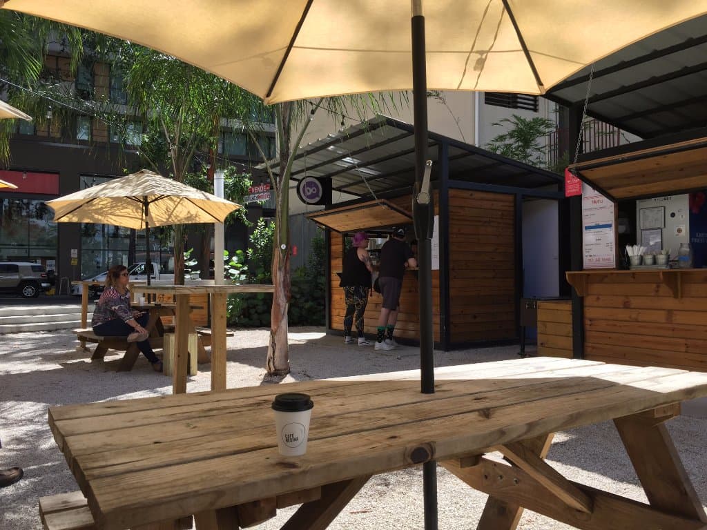 View of Kipsko with picnic tables & a cup of Cage regina