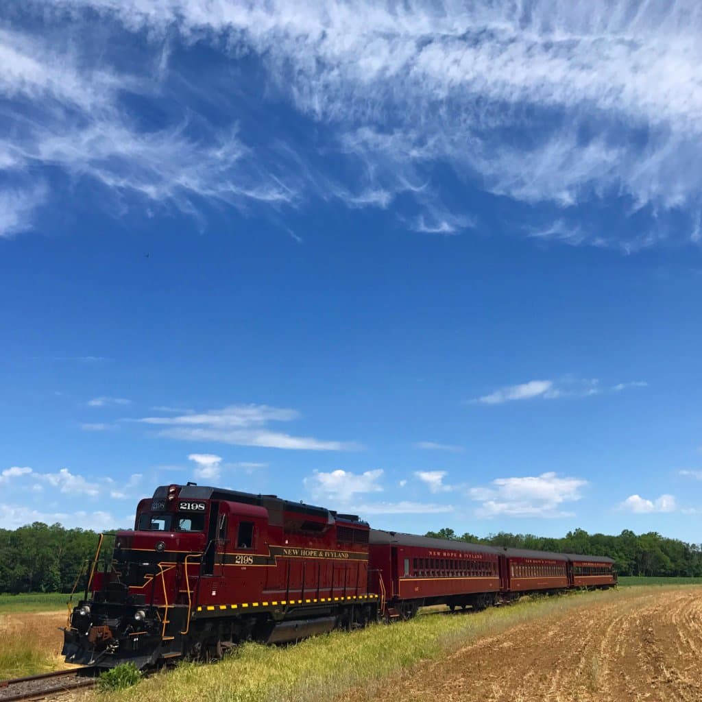 Excursion train traveling through None Such Farm in Buckingham Valley, Pennsylvania