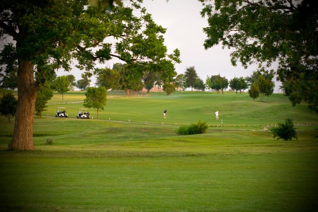 Some golfers enjoying our 14th hole. From the fairway of course!