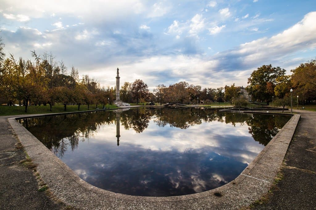 Known for its mature canopy trees, wide promenade, and lovely Lake Elizabeth