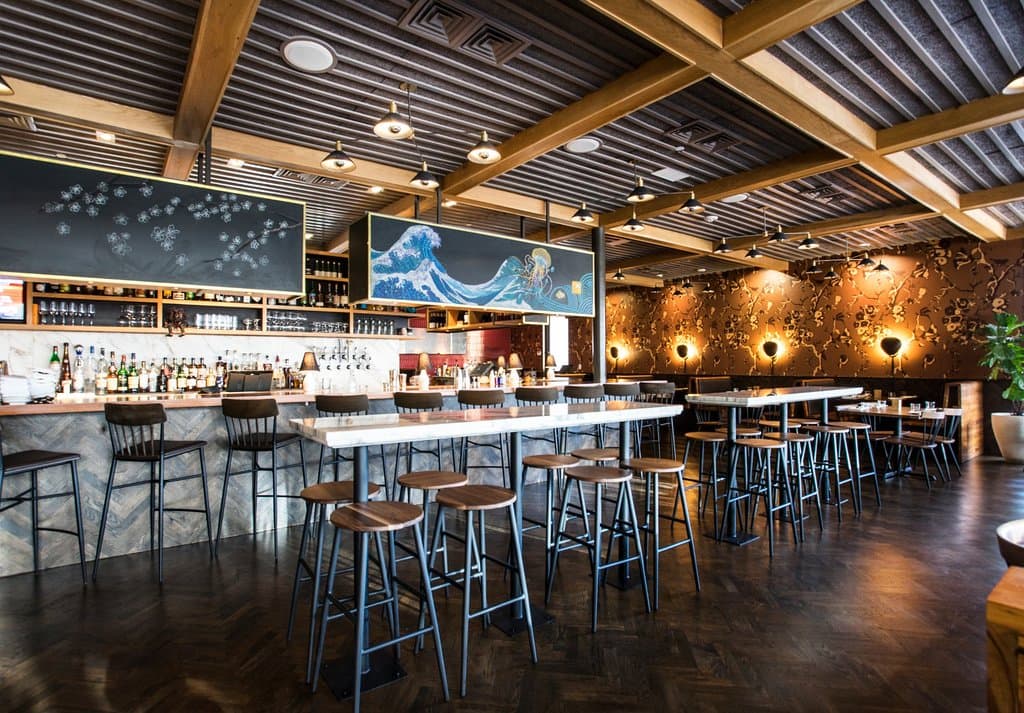 Choose from bar seating, high tops or tables.