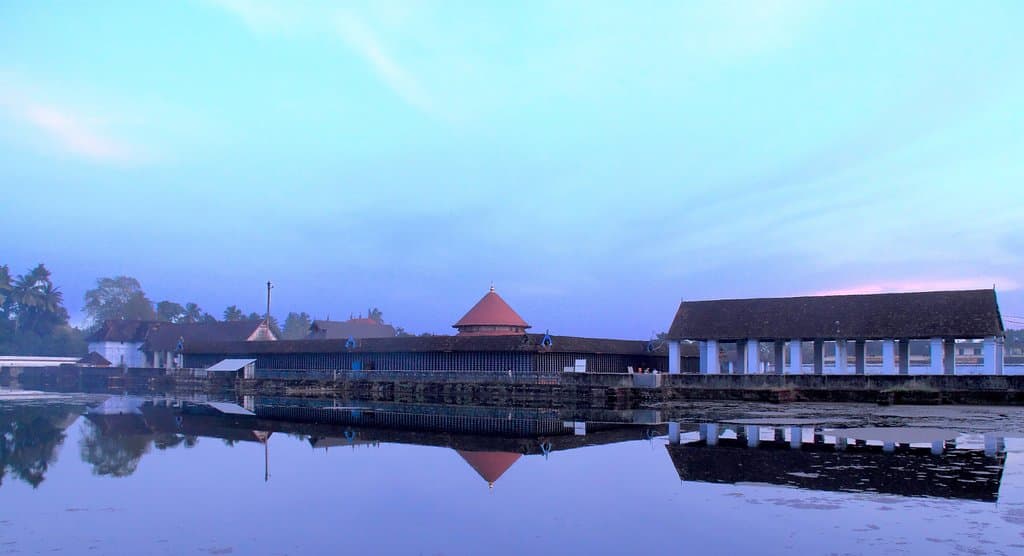 The grandeur of temple in front of its massive pond.