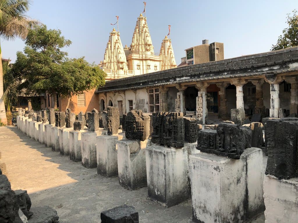 Rows of ruins from Somnath temple attacks are labeled and presented in the courtyard of the Muse