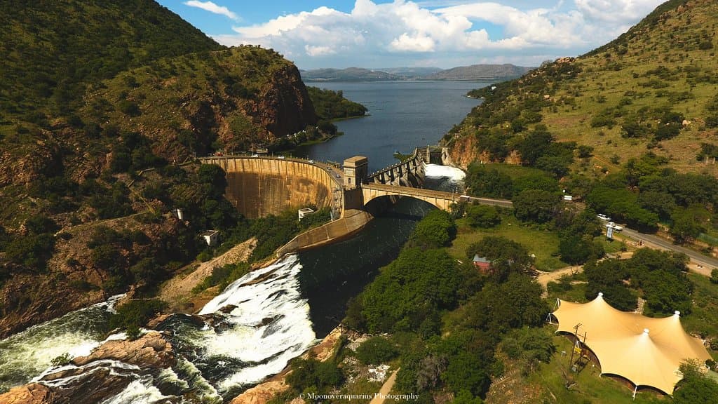 Drone coverage overlooking the dam ,one of the sluice gates open