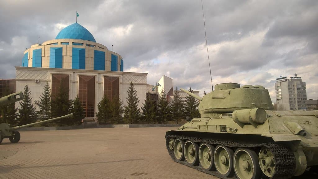 Museum from outside. Clearly visible to the main road. T-34 tank on the yard.
