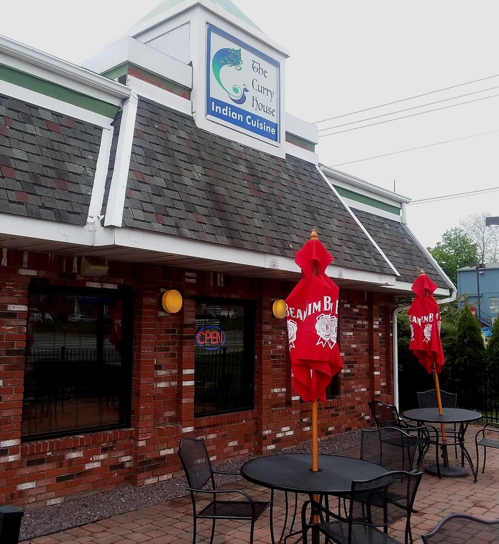 The Curry House Sign and Outside Seating